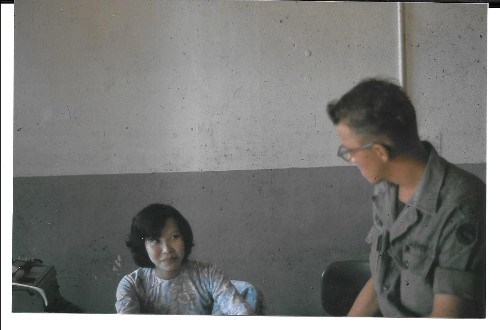 Miss Pham talking with Art Malzahn. She was one of the HQ typists / secretary. She was a very nice young girl.